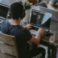 group of people using laptop computer